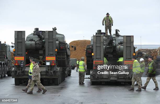 Crews prepare British Army Challenger 2 tanks of the 5th Battalion The Rifles for transport after the tanks and other heavy vehicles arrived by ship...