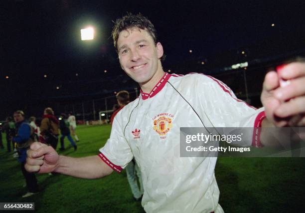 Manchester United captain Bryan Robson celebrates after the 1991 UEFA European Cup Winners Cup Final between Manchester United and Barcelona on May...