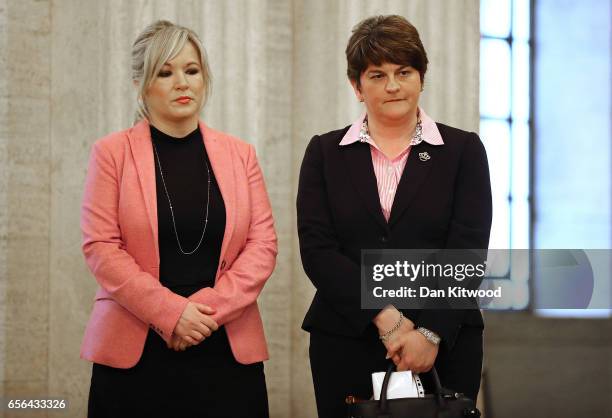 Sinn Fein leader Michelle O'Neill and Democratic Union Party Leader Arlene Foster wait to sign a book of condolence at Stormont on March 22, 2017 in...