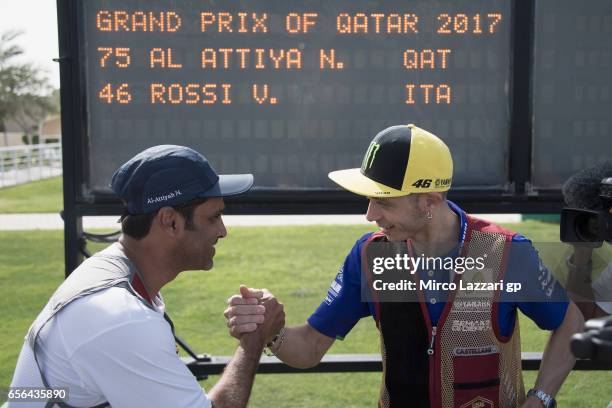 Valentino Rossi of Italy and Movistar Yamaha MotoGP greets with Nasser Al-Attiyah, London 2012 Men's Skeet Olympic Bronze Medalist in and former...