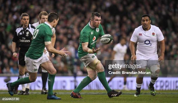 Dublin , Ireland - 18 March 2017; Peter O'Mahony of Ireland passes to team-mate Jonathan Sexton during the RBS Six Nations Rugby Championship match...