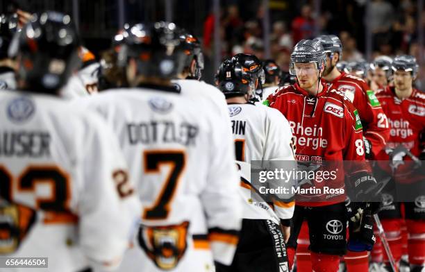 Philip Gogulla of Koeln looks dejected after losing the DEL Playoffs quarter finals Game 7 between Koelner Haie and Grizzlya Wolfsburg at Lanxess...