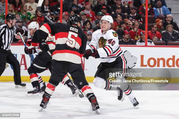 Cody Ceci of the Ottawa Senators defends against John Hayden of the Chicago Blackhawks at Canadian Tire Centre on March 16, 2017 in Ottawa, Ontario,...