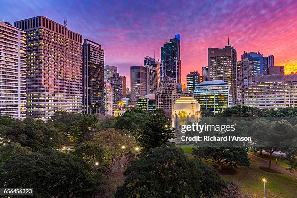 anzac war memorial in hyde park & city at sunset - 戦争記念碑 ストックフォトと画像