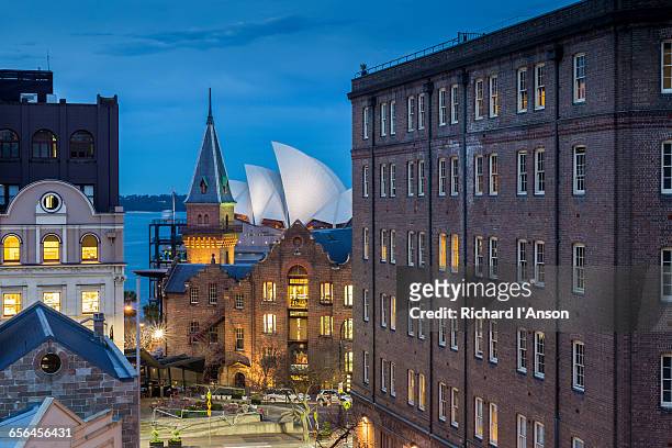 the rocks & sydney opera house at dusk - sydney architecture stock pictures, royalty-free photos & images