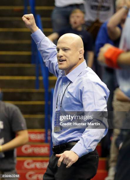 Head coach Cael Sanderson of the Penn State Nittany Lions celebrates during the championship finals of the NCAA Wrestling Championships on March 18,...