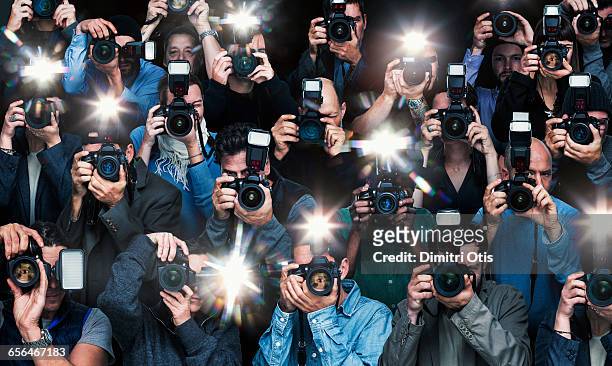 paparazzi photographers in action - paparazzi stock pictures, royalty-free photos & images