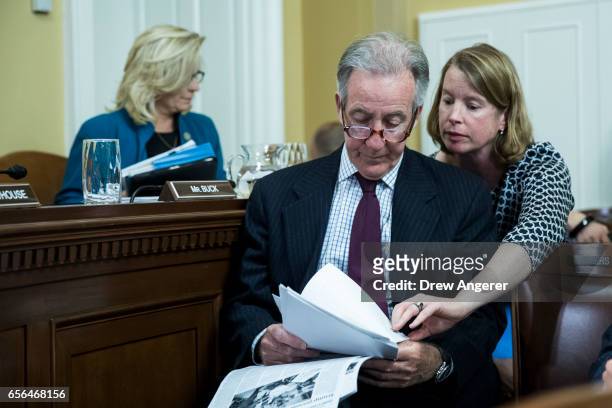 Rep. Richard Neal looks over notes with an aide during a House Rules Committee meeting to set the rules for debate and amendments on H.R.1628, the...