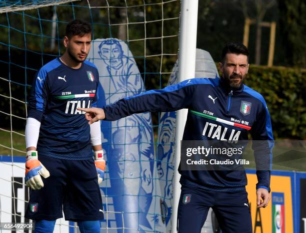 Gianluigi Buffon and Gianluigi Donnarumma of Italy look on during the training session at the club's training ground at Coverciano on March 22, 2017...