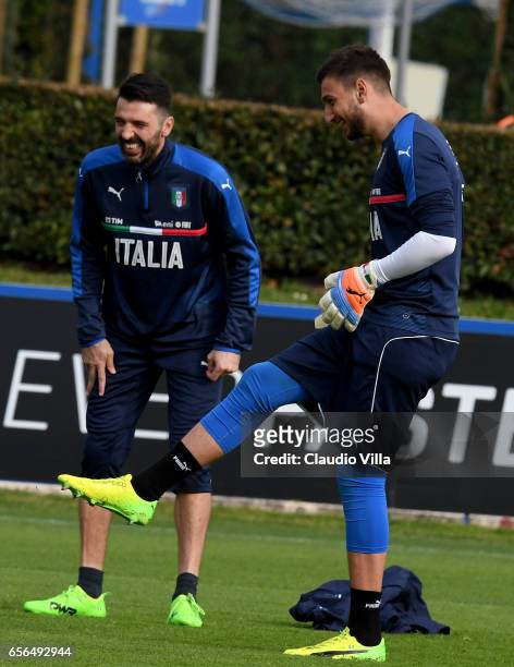 Gianluigi Donnarumma and Gianluigi Buffon of Italy in action during the training session at the club's training ground at Coverciano on March 22,...