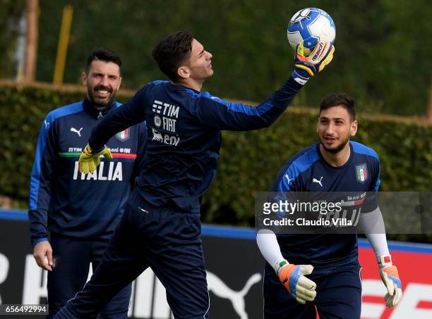Gianluigi Buffon, Alex Meret and Gianluigi Donnarumma of Italy in action during the training session at the club's training ground at Coverciano on...