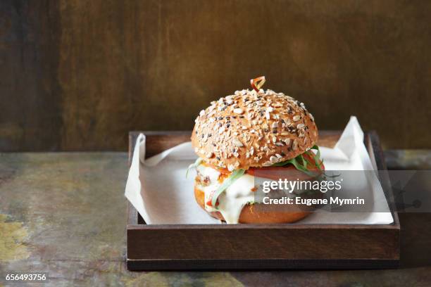 beef burgers with cheese and sauce - cheese sauce stock pictures, royalty-free photos & images