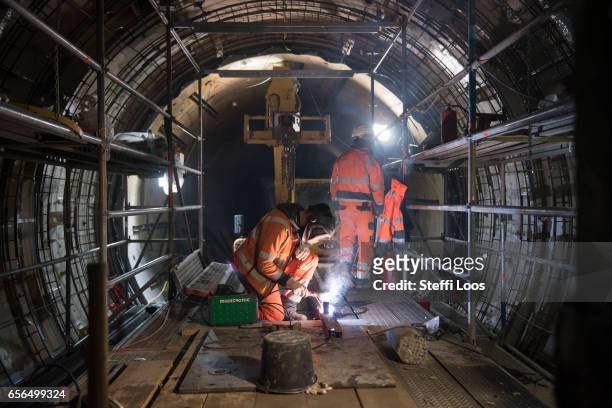 Workers stand in Underground Metro Tunnel U5 during a tunnel breakthrough on March 22, 2017 in Berlin, Germany. U5 is a line on the Berlin U-Bahn...