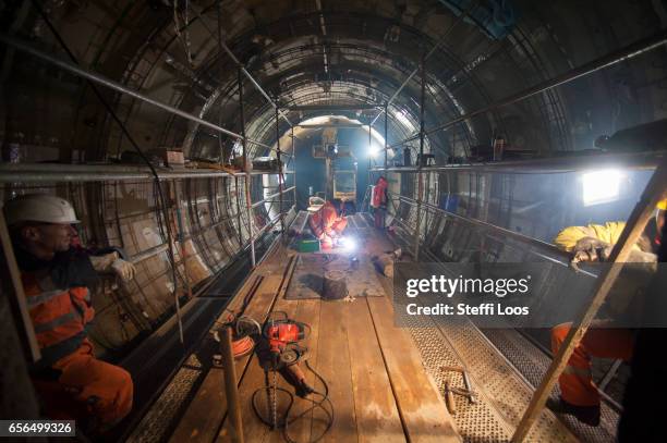 Workers stand in Underground Metro Tunnel U5 during a tunnel breakthrough on March 22, 2017 in Berlin, Germany. U5 is a line on the Berlin U-Bahn...