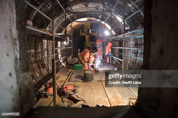 Workers stand in Underground Metro Tunnel U5 during a tunnel breakthrough on March 22, 2017 in Berlin, Germany. U5 is a line on the Berlin U-Bahn...