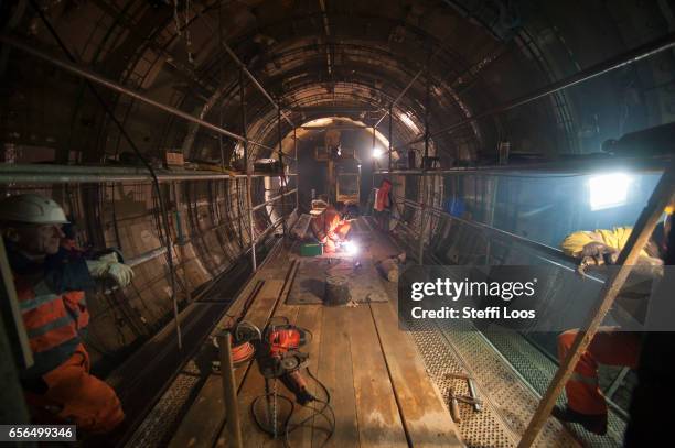 Workers stand in Underground Metro Tunnel U5 during a tunnel breakthrough on March 22, 2017 in Berlin, Germany. U5 is a line on the Berlin U-Bahn...