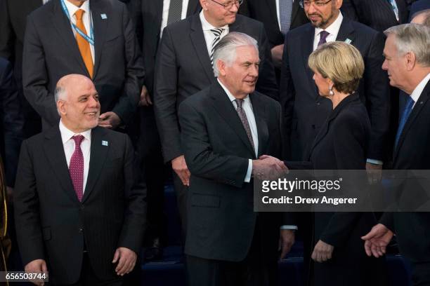 Prime Minister of Iraq Haider al-Abadi looks on as U.S. Secretary of State Rex Tillerson shakes hands with Australian Minister for Foreign Affairs...