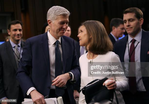 Judge Neil Gorsuch talks with his wife Marie Louise Gorsuch during the third day of his Supreme Court confirmation hearing before the Senate...