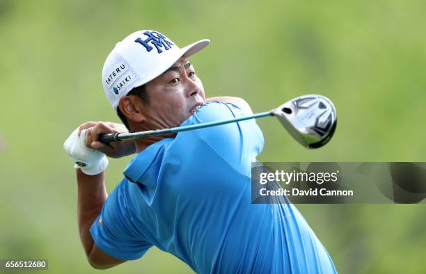 Hideto Tanihara of Japan plays his tee shot on the par 4, third hole in his match against Jordan Spieth of the united States during the first round...