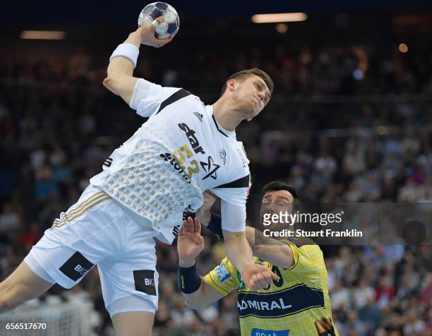 Nikola Bilyk of Kiel is challenged by Geden Guardiola of Rhein Neckar during the first leg round of 16 EHF Champions League match between THW Kiel...