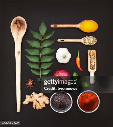 Assorted herbs and spices on black background. Assorted herbs and spices on black background.
