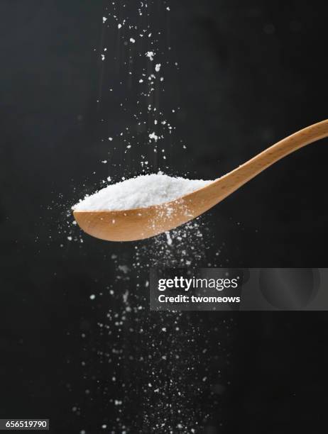 salt in wooden spoon. - geschmacksknospe stock-fotos und bilder