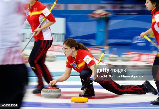 March 22, 2017 -- Liu Jinli of China delivers the stone during the World Women's Curling Championship round-robin match against Scotland in Beijing,...