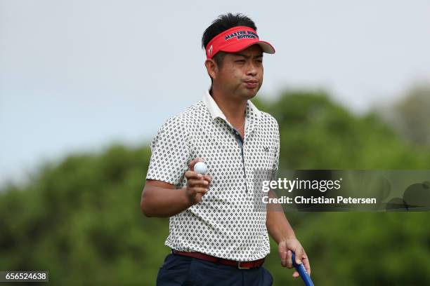 Yuta Ikeda of Japan reacts after putting on the 1st hole of his match during round one of the World Golf Championships-Dell Technologies Match Play...