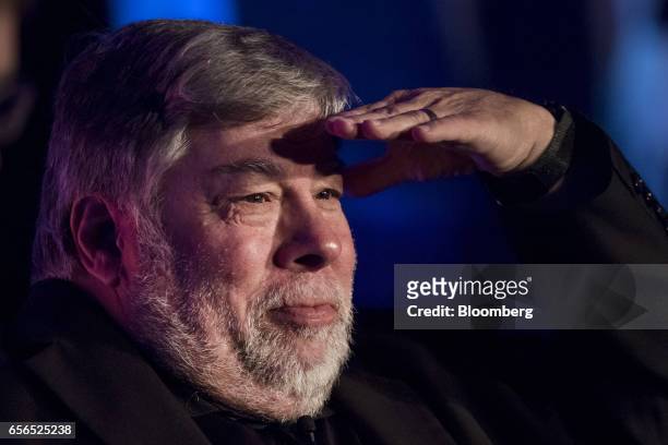 Steve Wozniak, co-founder of Apple Inc. And chief scientist of Primary Data, shields his eye while looking out to the attendees during the TechIgnite...