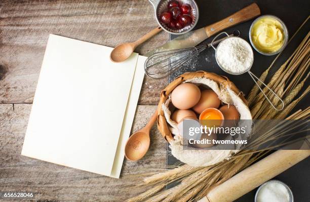 baking ingredients and utensils on rustic wooden background. - cookbook fotografías e imágenes de stock