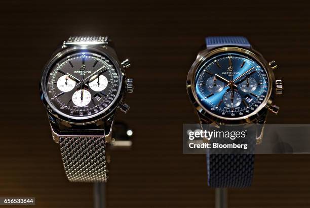 Two 'Transocean Chronograph' luxury wristwatches, produced by Breitling SA, stand on display during the 2017 Baselworld luxury watch and jewellery...