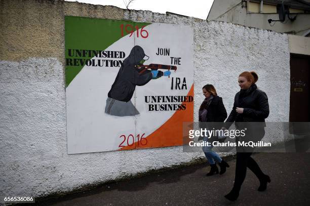 Republican mural close to the home of the late Martin McGuinness can be seen as mourners pay ther respects at the home of Martin McGuinness on March...