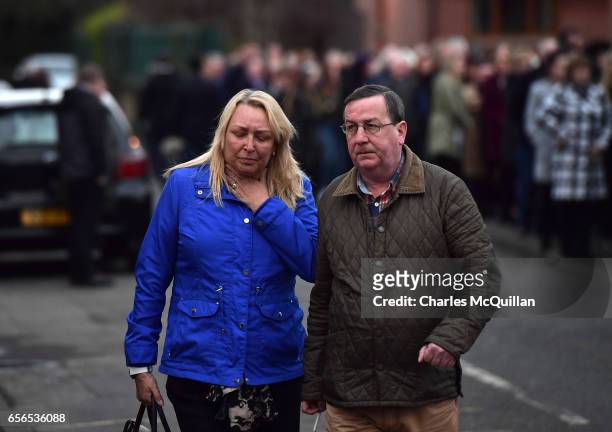 Woman is overcome with emotion as queues of mourners pay ther respects at the home of Martin McGuinness on March 22, 2017 in Londonderry, Northern...