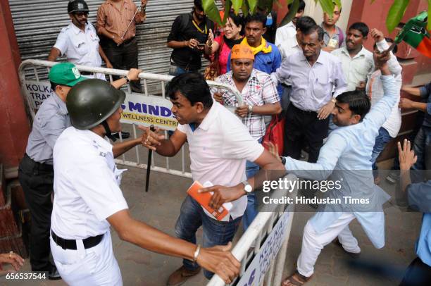 Leaders and supporters clash with the police during a protest rally demanding the arrest of Trinamool Congress leaders allegedly involved in Narada...