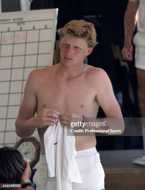 Boris Becker of West Germany changes his shirt during the Lipton International Tennis Championships in Boca West, Florida, circa February 1986....