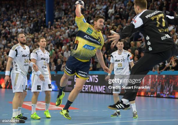 Hendrik Pekeler of Rhein Neckar scores the winning goal during the first leg round of 16 EHF Champions League match between THW Kiel and Rhein Neckar...