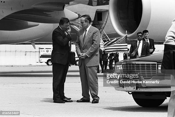 New York Mayor Rudy Giuliani and White House Chief of Staff Leon Panetta await the arrival of President Bill Clinton and First Lady Hillary Clinton...
