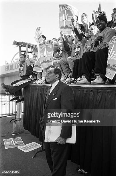 White House Chief of Staff Leon Panetta listens to President Bill Clinton speaking during his re-election bid at rally at Arizona State University...