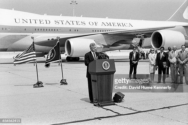 President Bill Clinton speaks with reporters regarding the crash of TWA Flight 800 on July 26, 1996. The crash off the coast of New York resulted in...