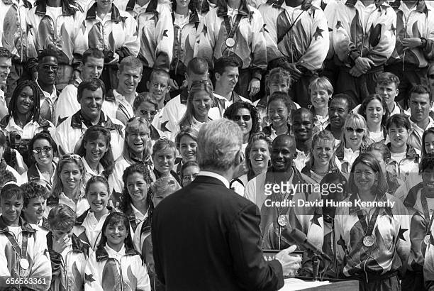 Members of the U.S. Olympic Team listen to remarks from President Bill Clinton on the South Lawn of the White House before a group picture with the...
