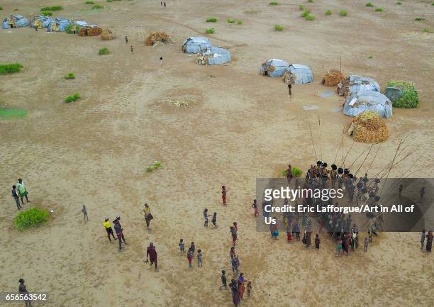 Aerial view of dimi ceremony in the Dassanech tribe to celebrate circumcision of teenagers, Omo Valley, Omorate, Ethiopia on March 9, 2017 in...