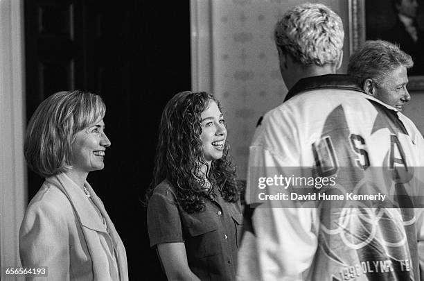 First Lady Hillary Clinton, daughter Chelsea and President Bill Clinton greet a member of the U.S. Olympic Team during a reception at the White House...