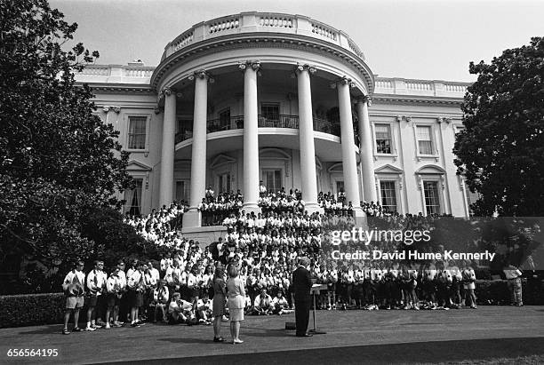 Members of the U.S. Olympic Team listen to remarks from President Bill Clinton on the South Lawn of the White House before a group picture with the...