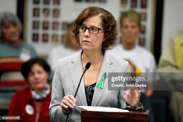 Jane Dougherty, sister of Mary Sherlach who's was shot and killed at Sandy Hook speaks out during the Colorado Coalition Against Gun Violence press...