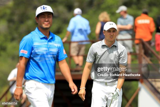 Hideto Tanihara of Japan and Jordan Spieth walk on the 13th hole of their match during round one of the World Golf Championships-Dell Technologies...