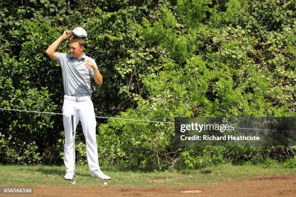 Jordan Spieth adjusts his hat on the 16th hole of his match during round one of the World Golf Championships-Dell Technologies Match Play at the...