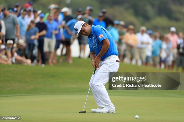 Hideto Tanihara of Japan putts on the 15th hole of his match during round one of the World Golf Championships-Dell Technologies Match Play at the...