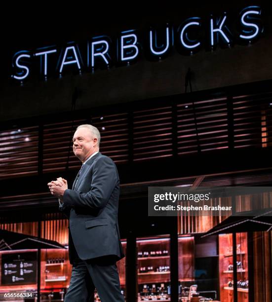 President and Chief Operating Officer Kevin Johnson smiles while taking the stage during the Starbucks annual meeting of shareholders on March 22,...
