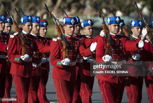 Picture shows royal guards marching ahead of the arrival of Morocco's and Jordan's kings for a welcome ceremony at the Royal Palace in Rabat on March...