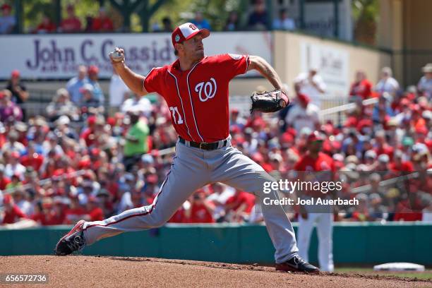 Max Scherzer of the Washington Nationals pitches against the St Louis Cardinals in the first inning during a spring training game at Roger Dean...